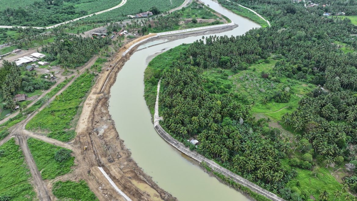 The DPWH XI photo shows a flood control project on the downstream section of the Lasang River